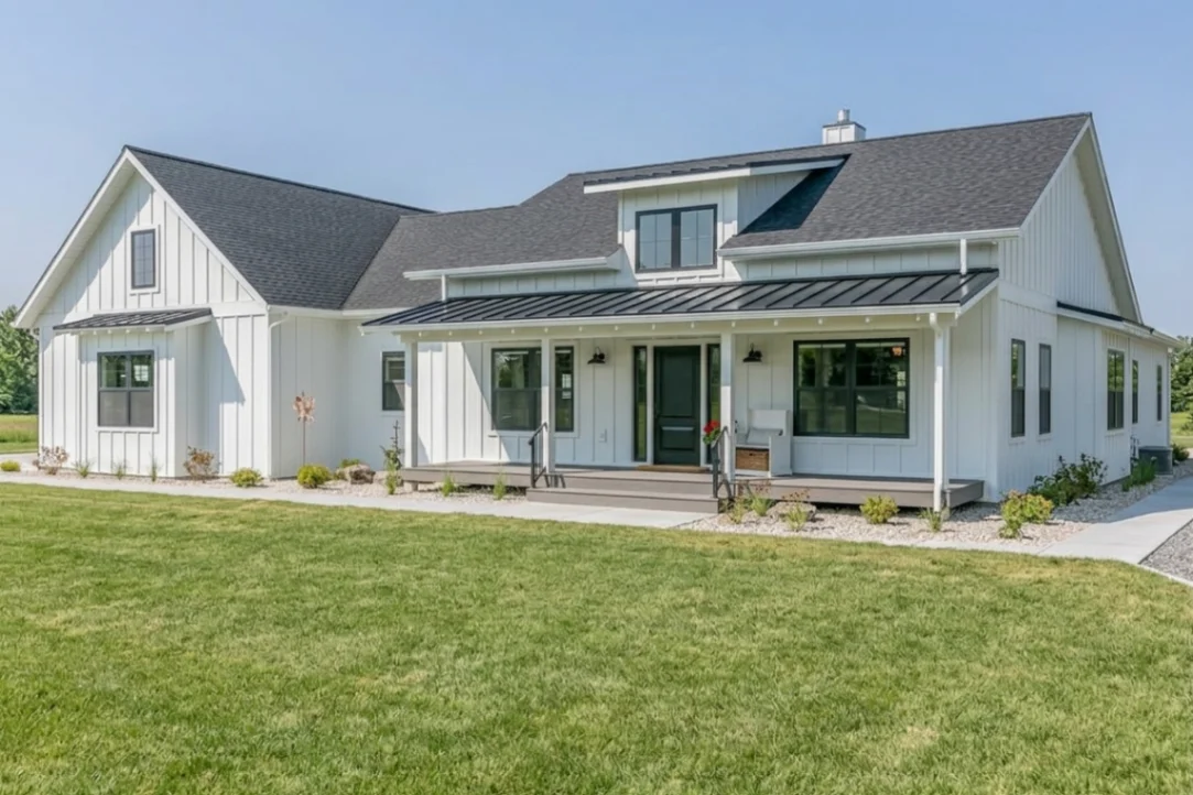 Modern farmhouse house exterior featuring vertical white board and batten siding with black window trim